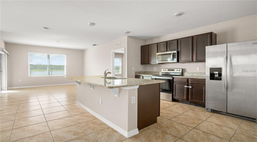 Kitchen With Dining Room Facing The Lake