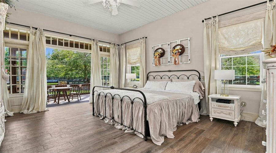 Primary Suite Opens Onto Wraparound Porch With Gorgeous French Doors And Transom Windows
