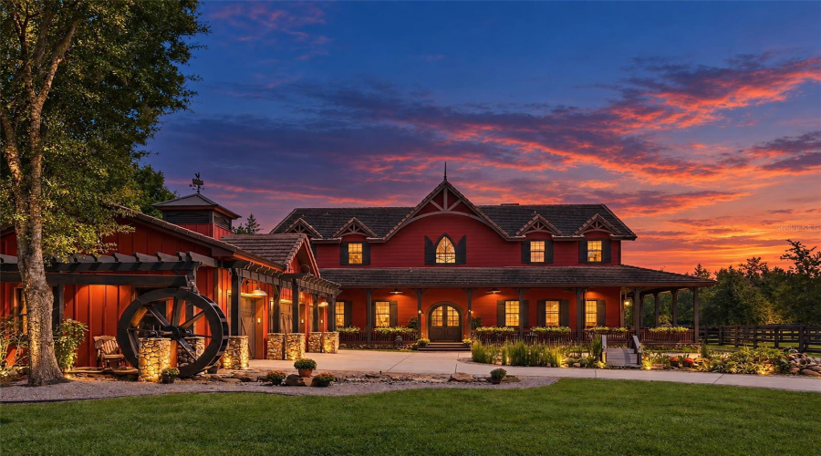 Lapping Water Over Paddle Wheel And Charming Koi Pond With Bridge Enhances The Charm Of This European Inspired Farm Estate