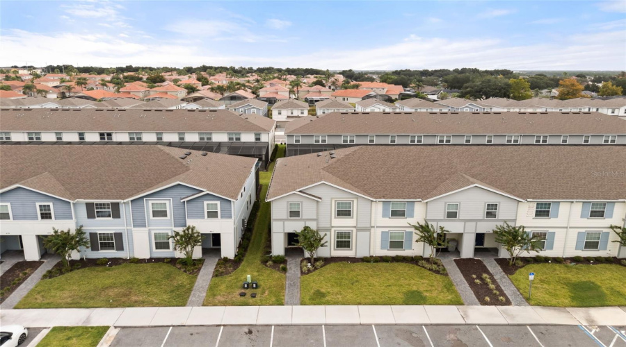 Aerial View Of The Property And The Community