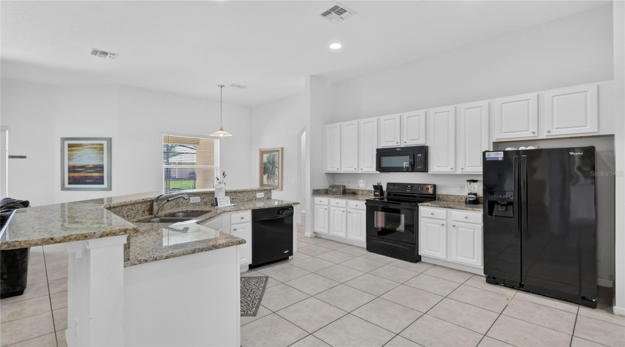 Large Open Concept Kitchen With Granite Countertops