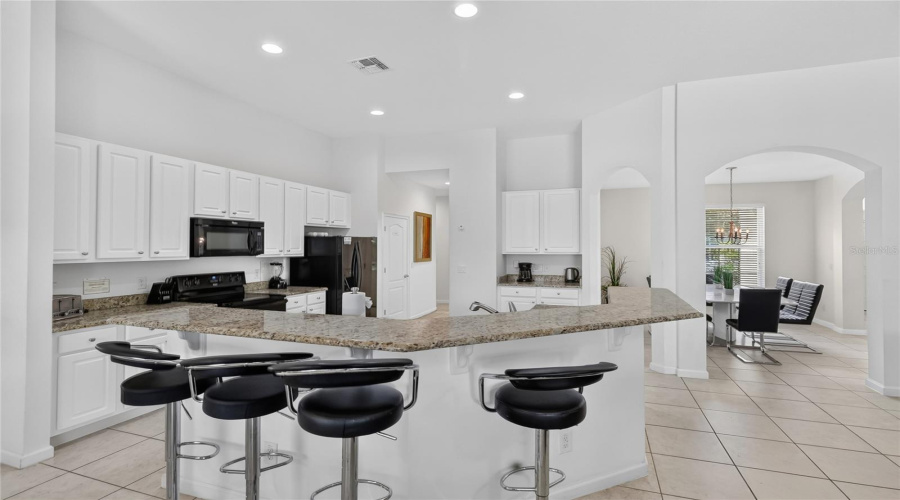 Plenty Of Seating At The Breakfast Bar, More Could Be Added.