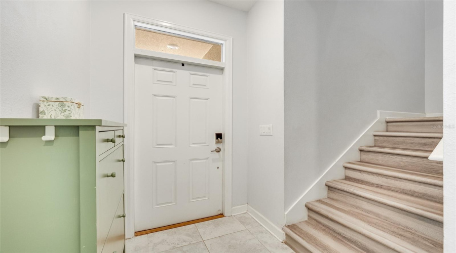 Foyer W/ Access Two Stairs For Second Story
