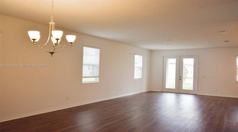 Spacious Living Area With Backyard Access
