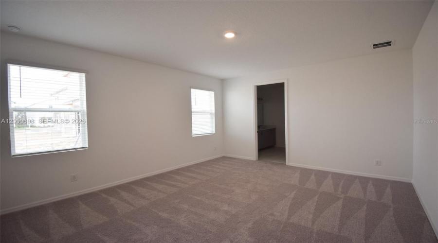 Bright Bedroom With Multiple Windows