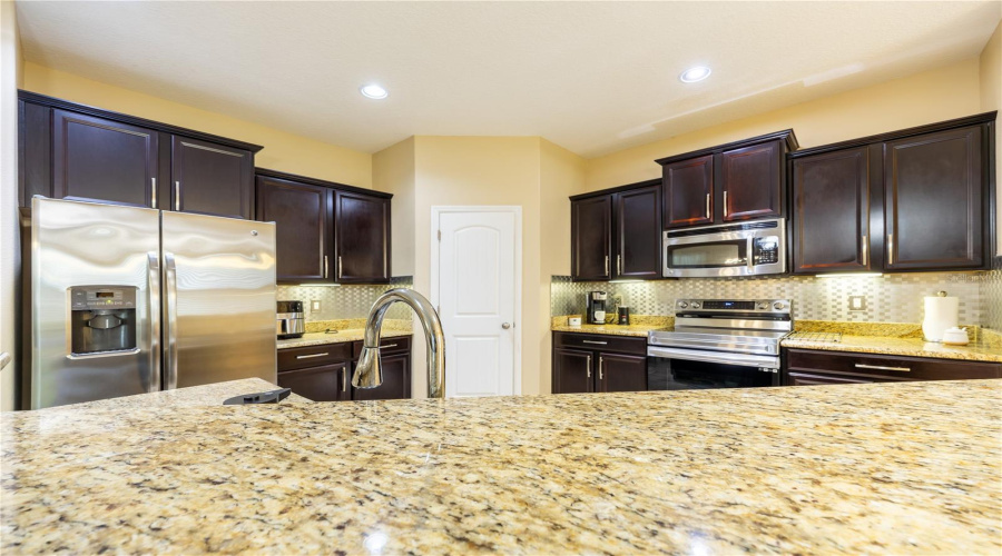 Kitchen With Granite Countertops And Stainless Steel Appliances