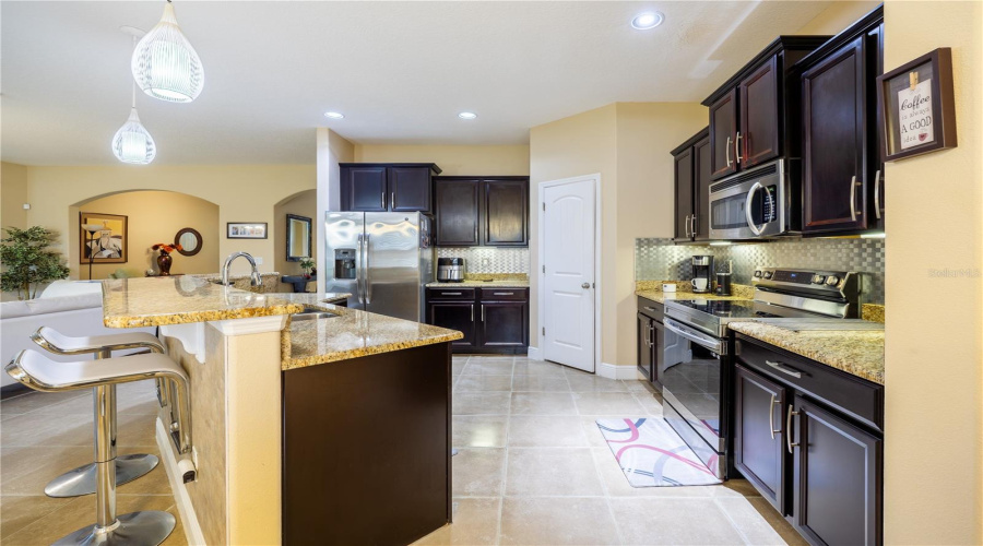 Kitchen With Ample Cabinet Space, Open To The Living Area