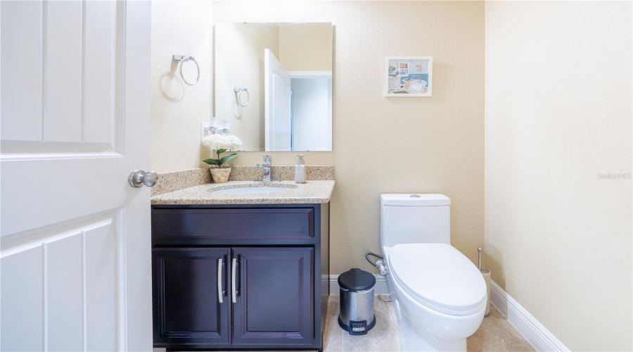 Main-Floor Half Bath With Granite Vanity