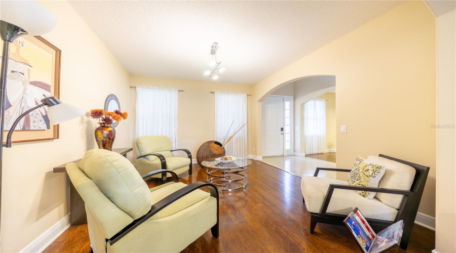 Flex Room With Arched Entry And Large Windows