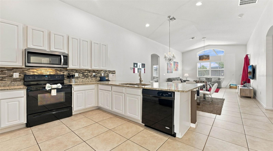 Open Kitchen Overlooking The Dining And Living Room.