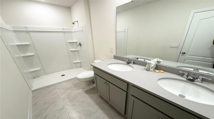 View Of Primary Bathroom From Entrance.