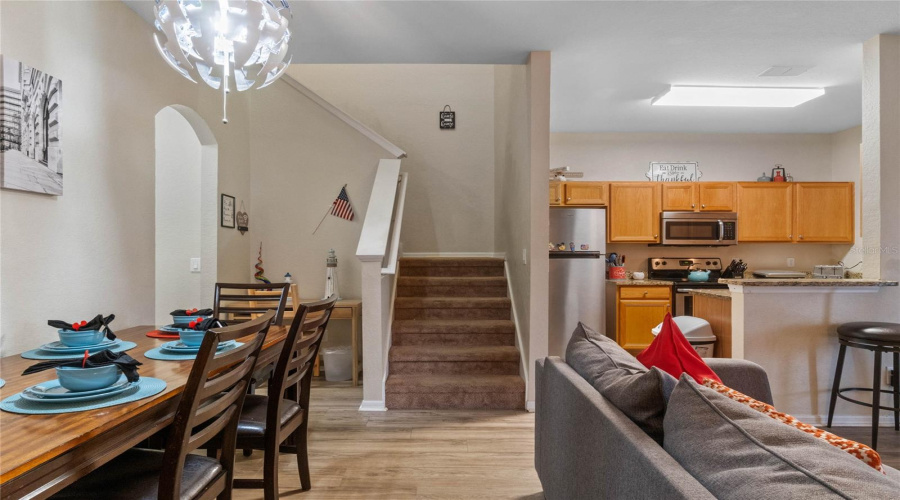 Dining Area With View To Kitchen And Stairs
