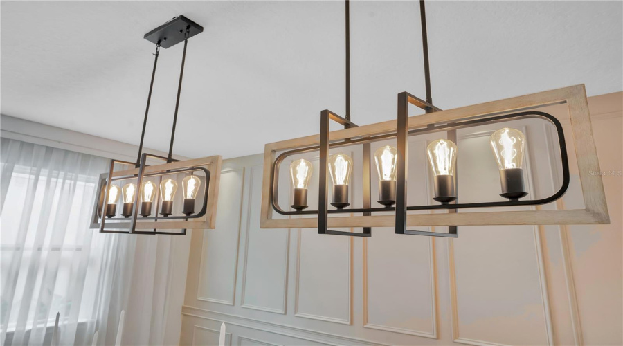 Statement Chandeliers Provide A Striking Finishing Touch To The Dining Room