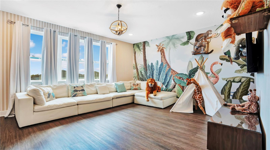 An Enchanting Jungle Book-Inspired Loft Brings The Magic Of The Jungle To Life With Vibrant Custom Murals, Whimsical Details, And A Welcoming Space For Guests Of All Ages To Gather And Unwind